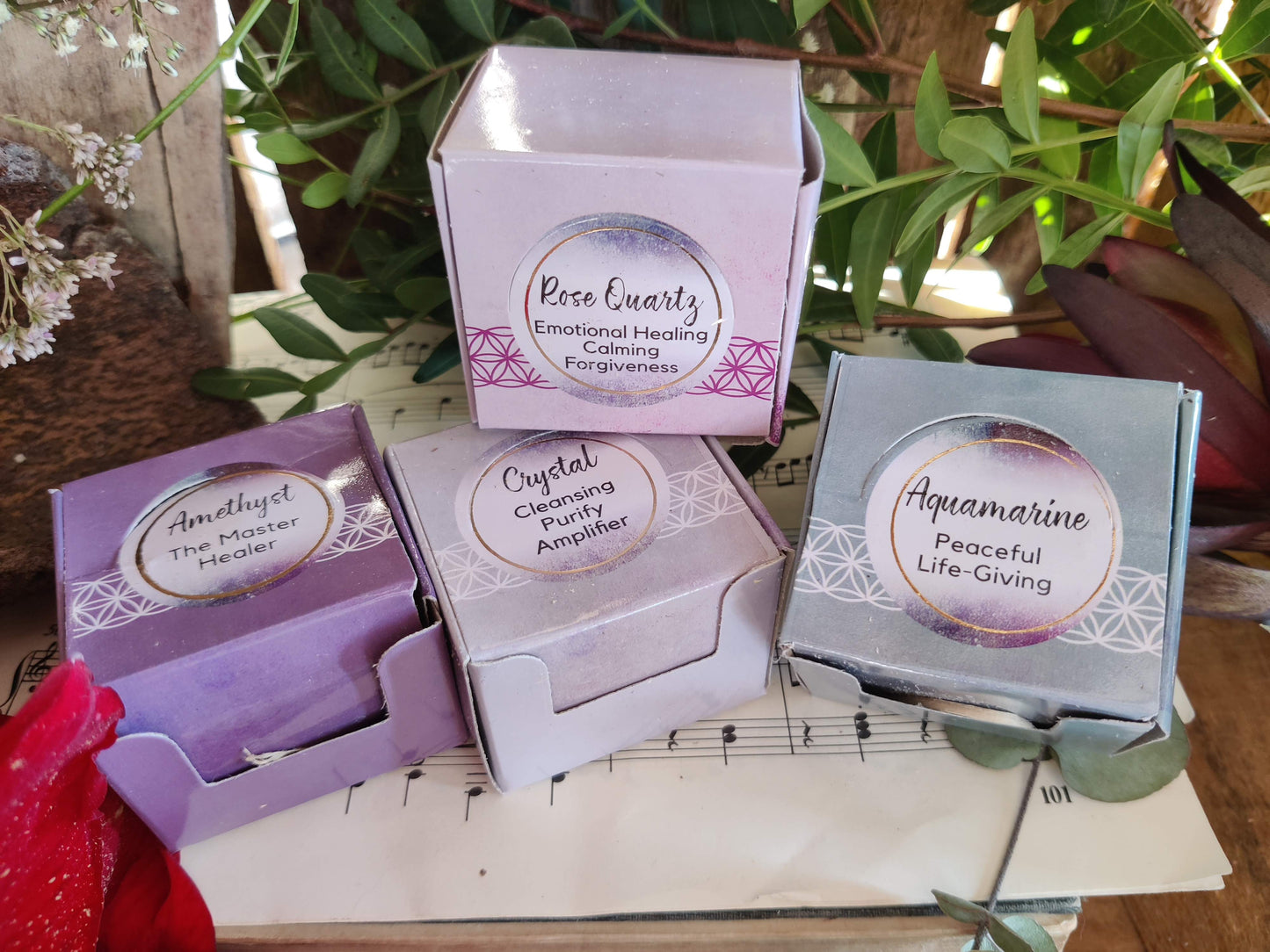 Heilsteine in kleiner Box - Amethyst, Bergkristall, Rosenquarz und Aquamarin